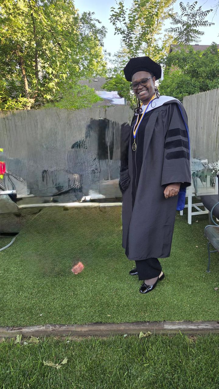 Rev. Dr. Josephine W. Mutuota in doctoral regalia